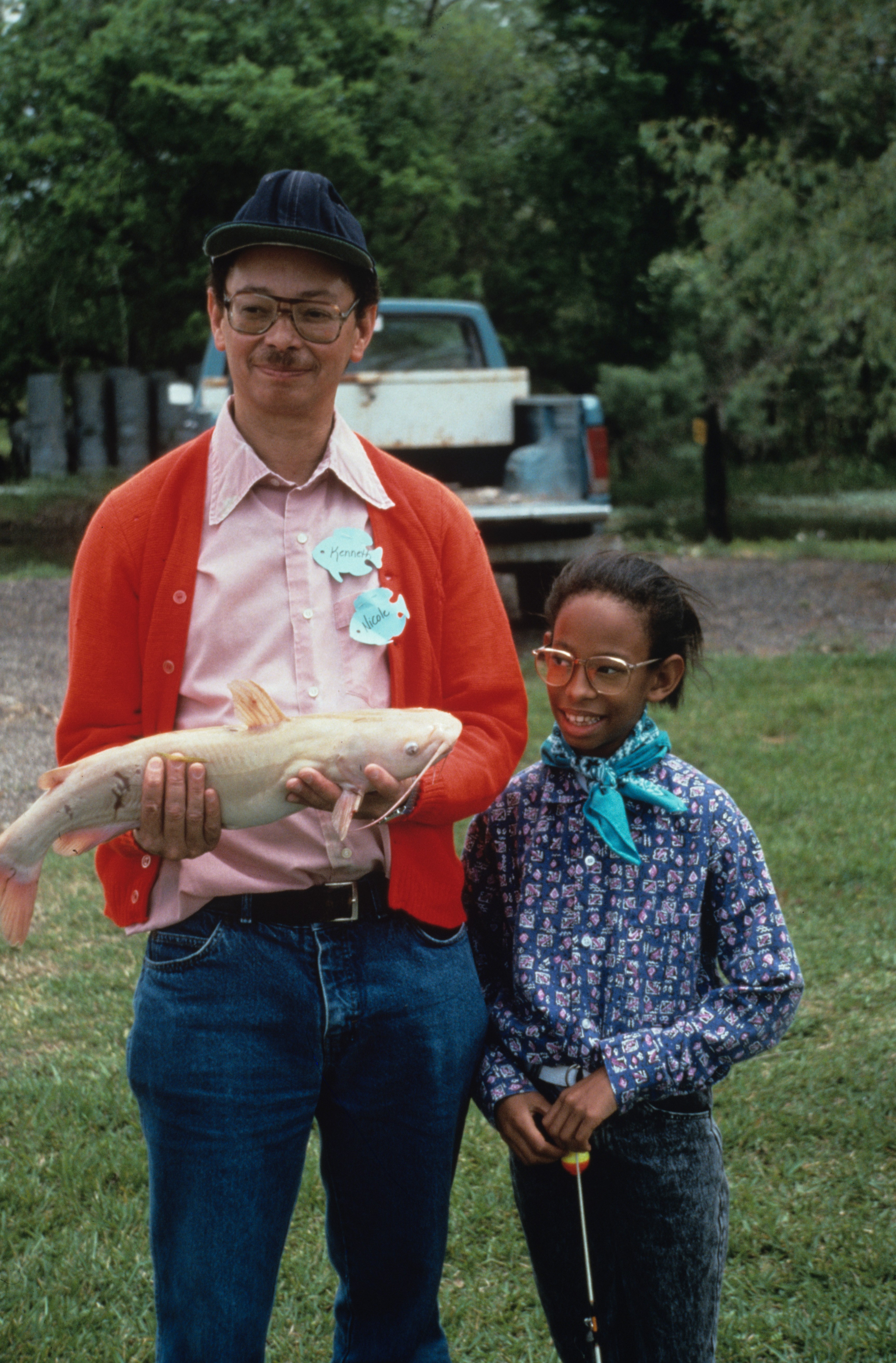 Image of man and girl at Lake Sheldon with fish